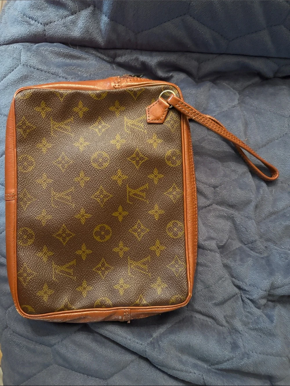 Louis Vuitton Brown Leather Monogram cosmetic case with wristlet strap.